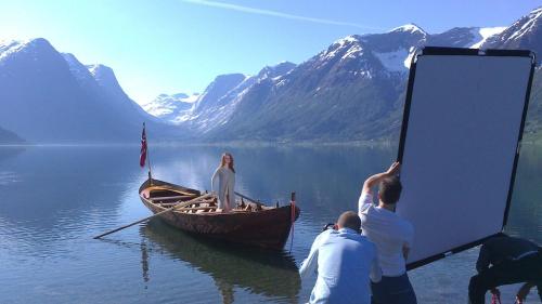 a group of people on a boat in the water at Flo Lake House in Stryn