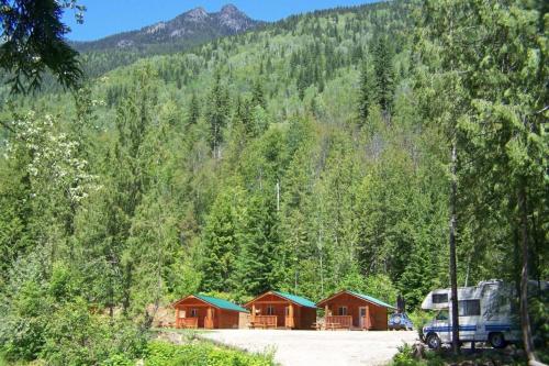 a truck parked in front of a bunch of houses at Noah's Ark Campground in Revelstoke