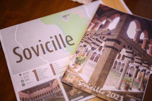 a magazine sitting on top of a table at Pescini's Home in Rosia