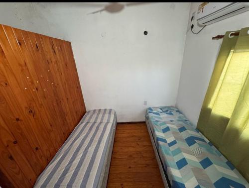 Postel nebo postele na pokoji v ubytování Cataratas Duplex Depto1