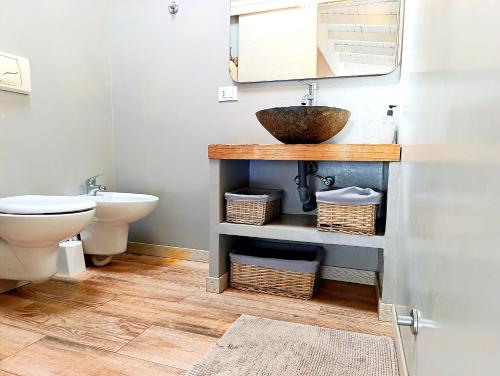 a bathroom with a sink and a toilet at Boadream Ca' Madeira 1 Attico Linea Prestige in Sal Rei