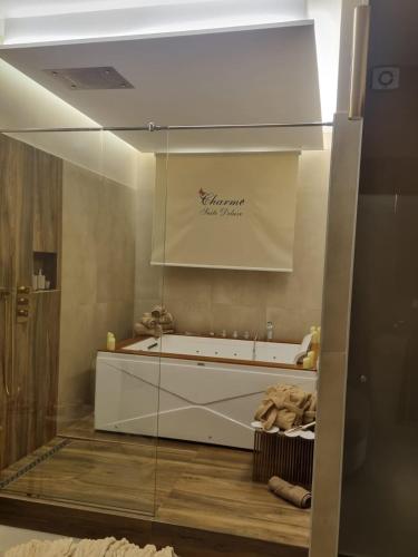 a bathroom with a large tub in a room at charme suite delux in Terrasini