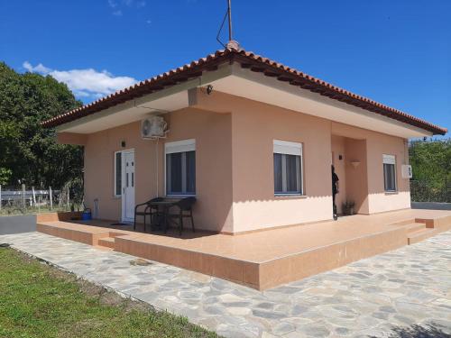 a small house with a patio in front of it at Meteora view Guesthouse in Kalabaka