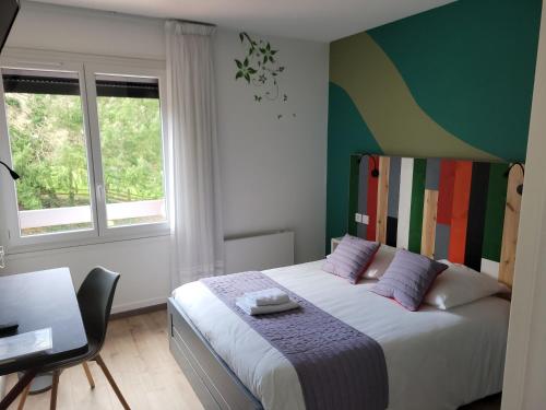 Postel nebo postele na pokoji v ubytování Hôtel Les Rives D'Allier