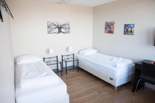 Ένα ή περισσότερα κρεβάτια σε δωμάτιο στο Lyngás Guesthouse