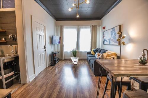 a living room with a couch and a table at Downtown Dwelling 1612 in Redding