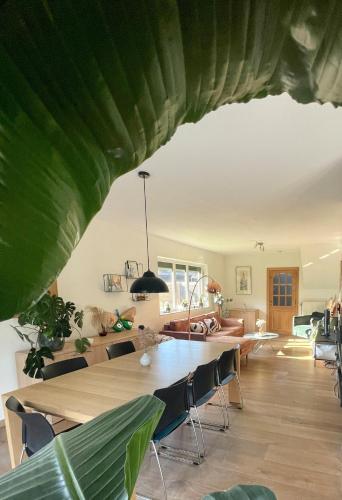 a dining room with a table and chairs at Lovely house next to Tomorrowland in Boom