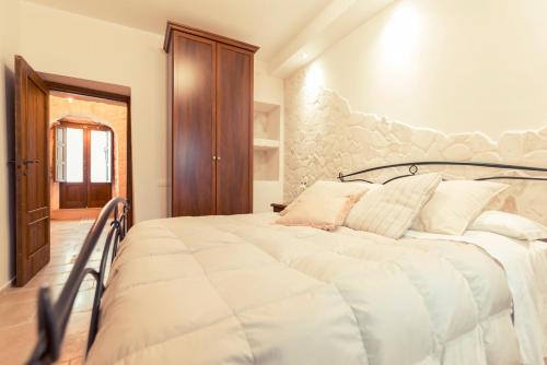 Letto o letti in una camera di Widespread Trulli in the historic center - Trulli Antichi Mestieri