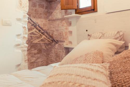 Letto o letti in una camera di Widespread Trulli in the historic center - Trulli Antichi Mestieri