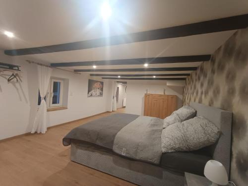 a bedroom with a large bed in a room at Ferienwohnung 2 in Bad Essen