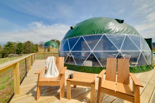 a gazebo on a deck with two chairs at Glamping Getaway at The Coyote Dome in Franklin in Franklin