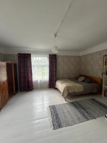 Ένα ή περισσότερα κρεβάτια σε δωμάτιο στο Jõevaara Veskitalu