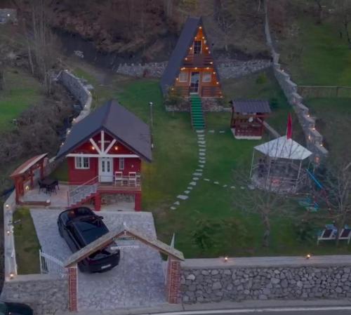 an aerial view of a house and a playground at Vilat Pllumaj in Gropat e Selcës