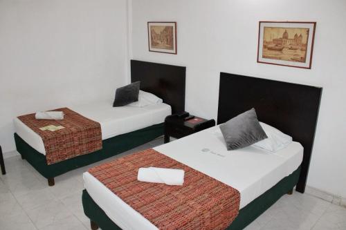 Uma cama ou camas num quarto em Park Hotel