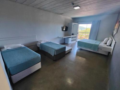 Postel nebo postele na pokoji v ubytování Luz da Lua Pousada