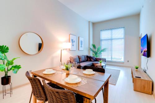 a living room with a table and a couch at Convenient Apartment Near Major Sights in Arlington