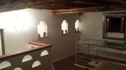 a bathroom with a glass counter and a mirror at Garibaldi home Fabrizia in Castellammare del Golfo