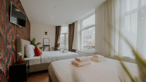 Ένα ή περισσότερα κρεβάτια σε δωμάτιο στο Hotel Heye 130