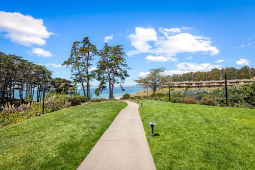 a walkway through a park with green grass at Spectacular Ocean View in Aptos