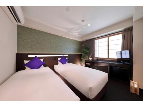 Katil atau katil-katil dalam bilik di Marutamachi Crystal Hotel - Vacation STAY 05345v