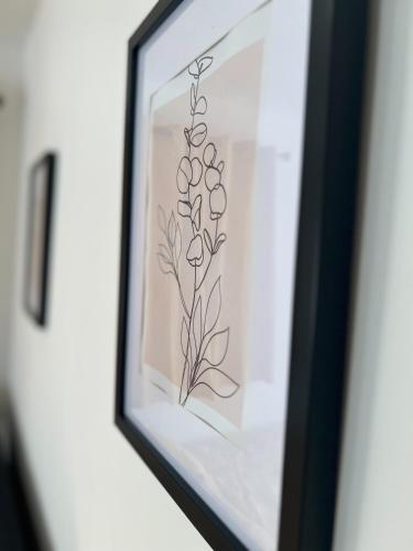 a drawing of a flower in a picture frame at The Ingram Arms in Laughton