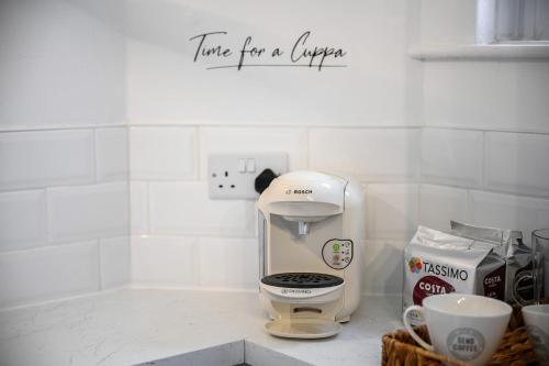 a coffee maker on a counter in a kitchen at Luxury Modern Home Great Harwood - Sleeps Up to 8 in Great Harwood