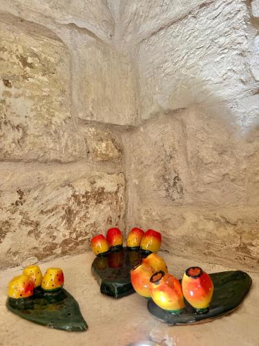 a group of rubber ducks on glass plates in a cave at Corte Ludovica in Martano