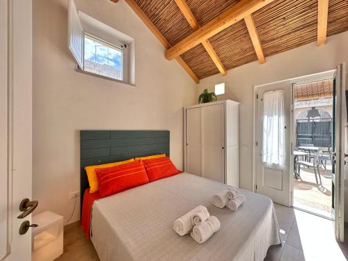 a bedroom with a bed with towels on it at Corte Ludovica in Martano