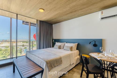 Una cama o camas en una habitación de NWTs - Estudios con vista lateral al mar en Maceió III
