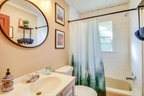 a bathroom with a sink and a toilet and a mirror at Lakefront Minnesota Escape with Fire Pit and Boat Dock in Emily