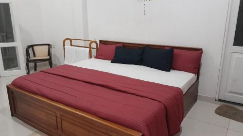 Postel nebo postele na pokoji v ubytování The White House Kandy