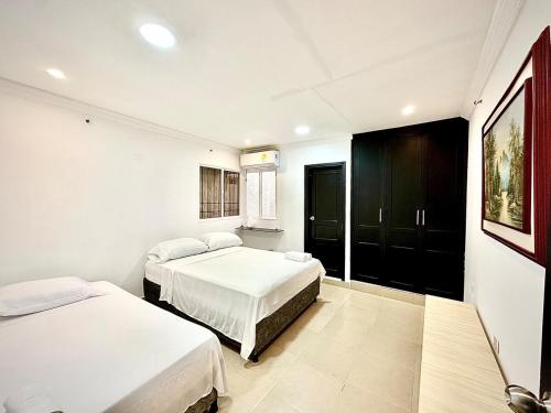 Ένα ή περισσότερα κρεβάτια σε δωμάτιο στο Casa frenesí - Estilo Guajiro