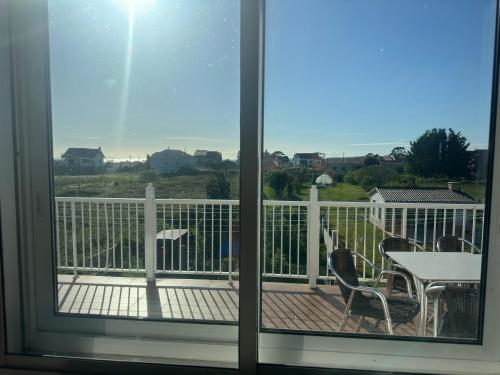 a view of a balcony with a table and chairs at CASA Nieves in O Grove