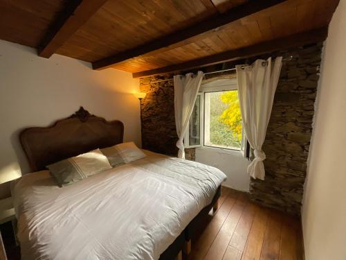 En eller flere senge i et værelse på La charmante **** Maison Cap Corse, Tomino