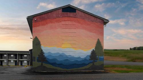 a large mural on the side of a building at Motel 6 Hickory NC in Hickory