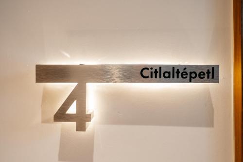 a sign with the number four on a door at Casa Castillo Condesa in Mexico City