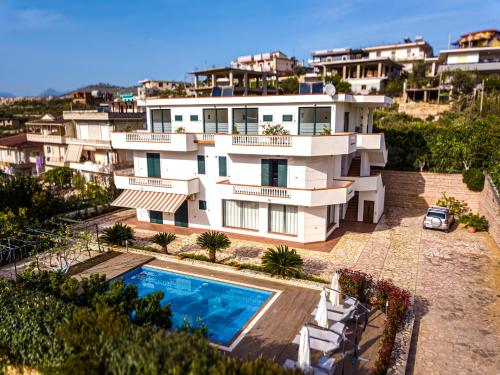 an aerial view of a house with a swimming pool at Villa La Quiete - Adults only in Ksamil