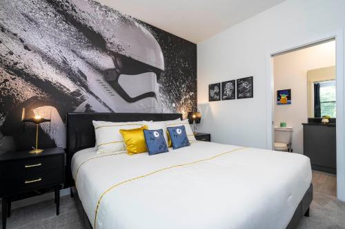 a bedroom with a bed with a black and white wall at Luxury 3 Bed Home up to 8 guests- The Hub - 3236 TT in Orlando