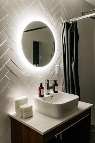 a bathroom with a sink and a mirror at Casa Castillo Condesa in Mexico City