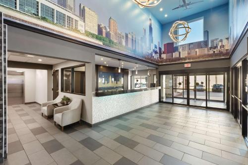 a lobby of a building with a waiting area at Best Western Inn & Suites - Midway Airport in Burbank