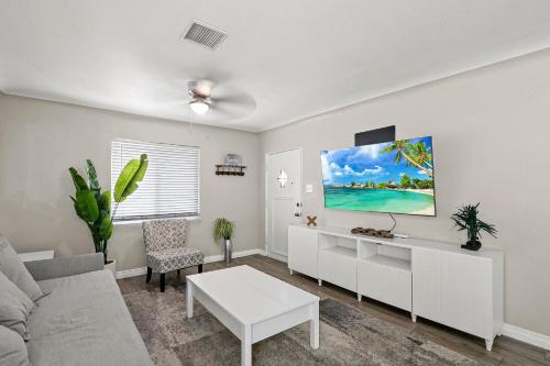 a living room with a couch and a table at Renovated Stay, Parking, Near DT & Airport in El Paso