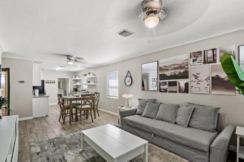 a living room with a couch and a table at Renovated Stay, Parking, Near DT & Airport in El Paso