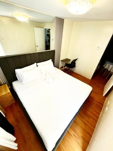 Ένα ή περισσότερα κρεβάτια σε δωμάτιο στο Cozy Suites 2BR Condotel in Davao City Near airport, Sasa wharf going to samal, SMX SM lanang