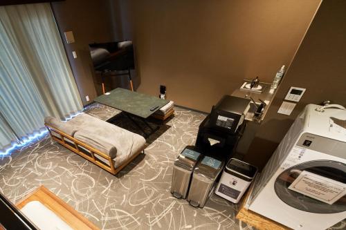 a hospital room with a bed and a sewing machine at BbyC Hotel 那覇 レンタカー付ホテル in Naha