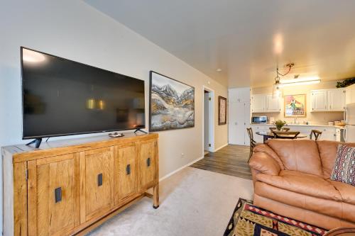 a living room with a large flat screen tv at 2 Mi to Bitterroot River Downtown Corvallis Apt! in Hamilton