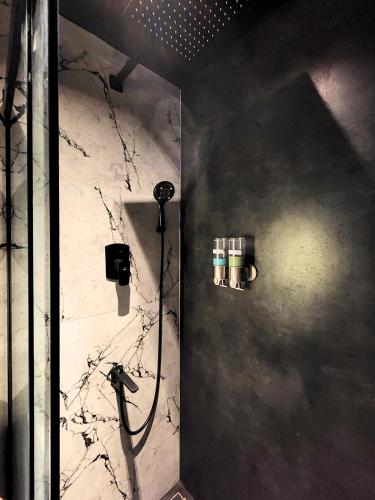a bathroom with a shower with a shower at Luxury Stylish Comfort Near Airport, bus and train station in Chennai