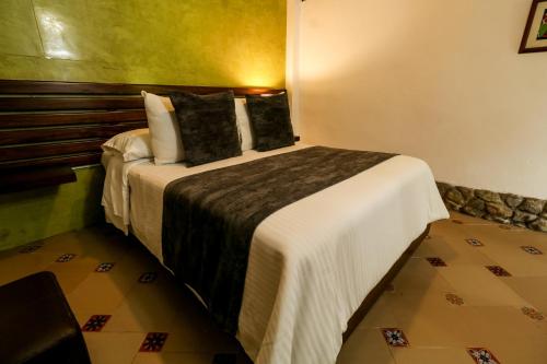 Katil atau katil-katil dalam bilik di Hotel Vísperas