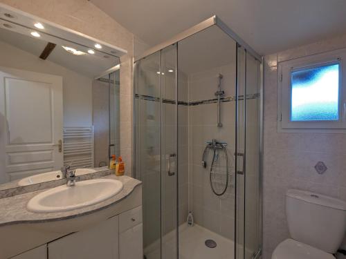 a bathroom with a shower and a sink and a toilet at Chambres d'hôtes avec jardin près des châteaux de la Loire - FR-1-591-666 in Châtillon-sur-Indre