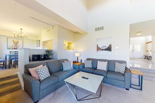 a living room with a couch and a table at Wintergreen 122 in Blue Mountains