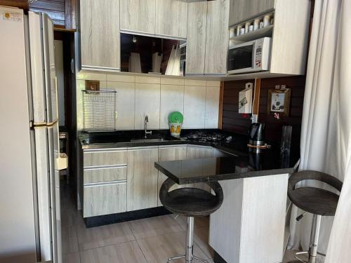 Kuchyň nebo kuchyňský kout v ubytování Casa em Penha - Armação-Itapocoroy